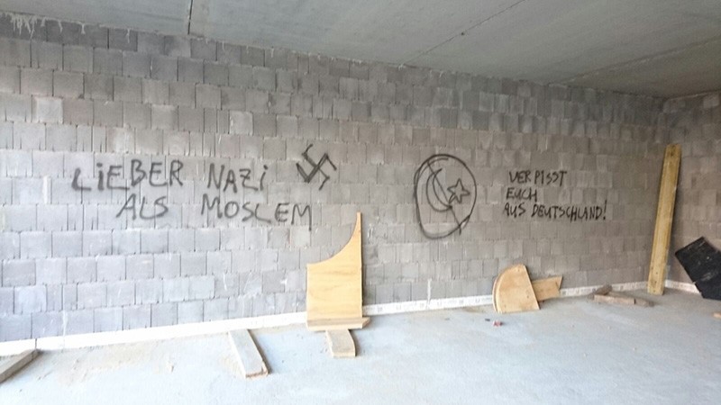 This file photo dated July 7, 2016 shows neo-Nazi slogans and a swastika sprayed on the walls of a Turkish-Islamic Union for Religious Affairs (DITIB) mosque under construction in Herringen, North-Rhine Westphalia, Germany. (AA Photo)