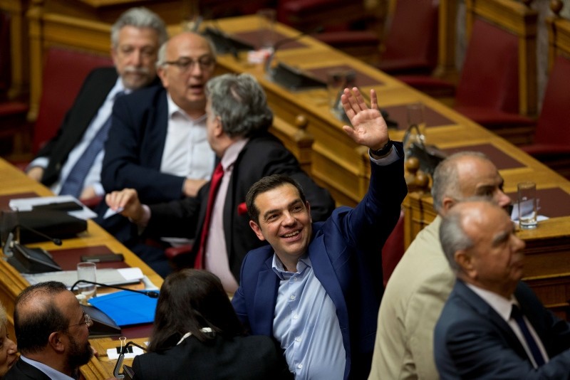 Greek Prime Minister Alexis Tsipras votes during a parliamentary session , in Athens, on Saturday, June 16, 2018. (AP Photo)