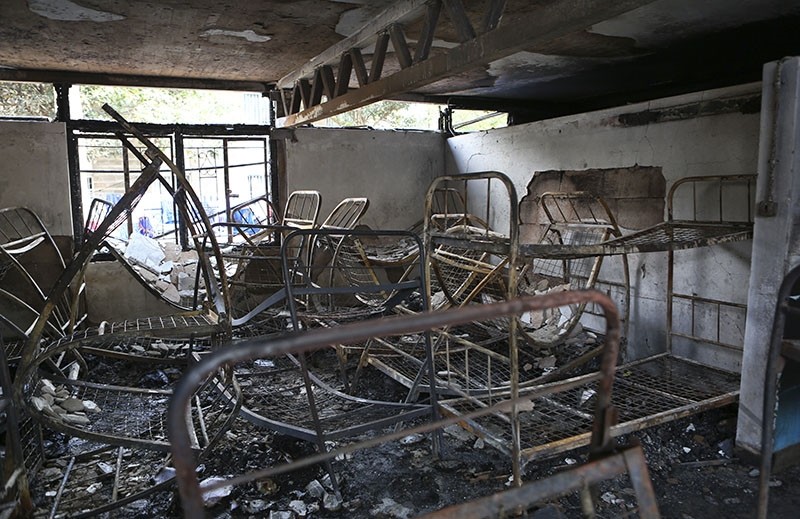 Metal bed frames are seen in a burned-out dormitory, following a fire at the Moi Girls High School in Nairobi, Kenya, Saturday, Sept. 2, 2017. (AP Photo)