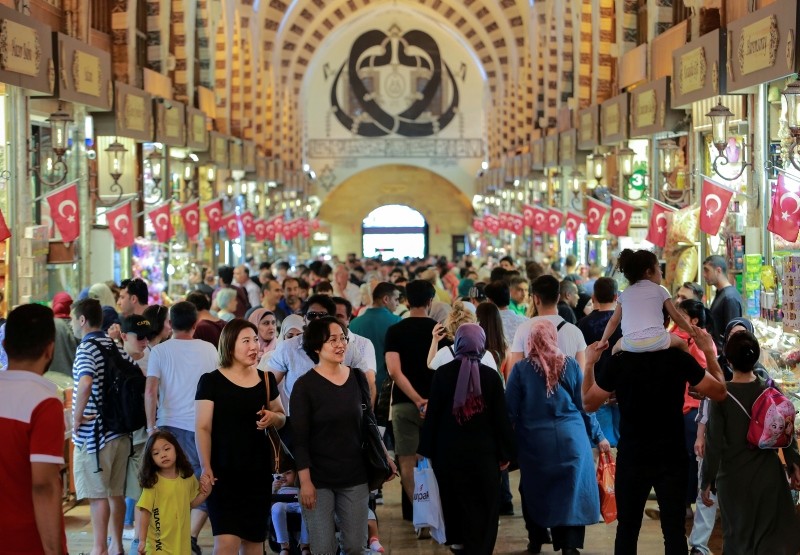 People walk in a market in Istanbul, Monday, Aug. 13, 2018. (AP Photo)