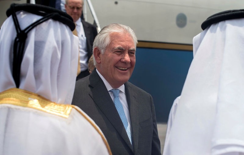 Qatari Ministry of Foreign Affairs officials welcome U.S. Secretary of State Rex Tillerson to Doha, Qatar, Tuesday, July 11, 2017. (AP Photo)
