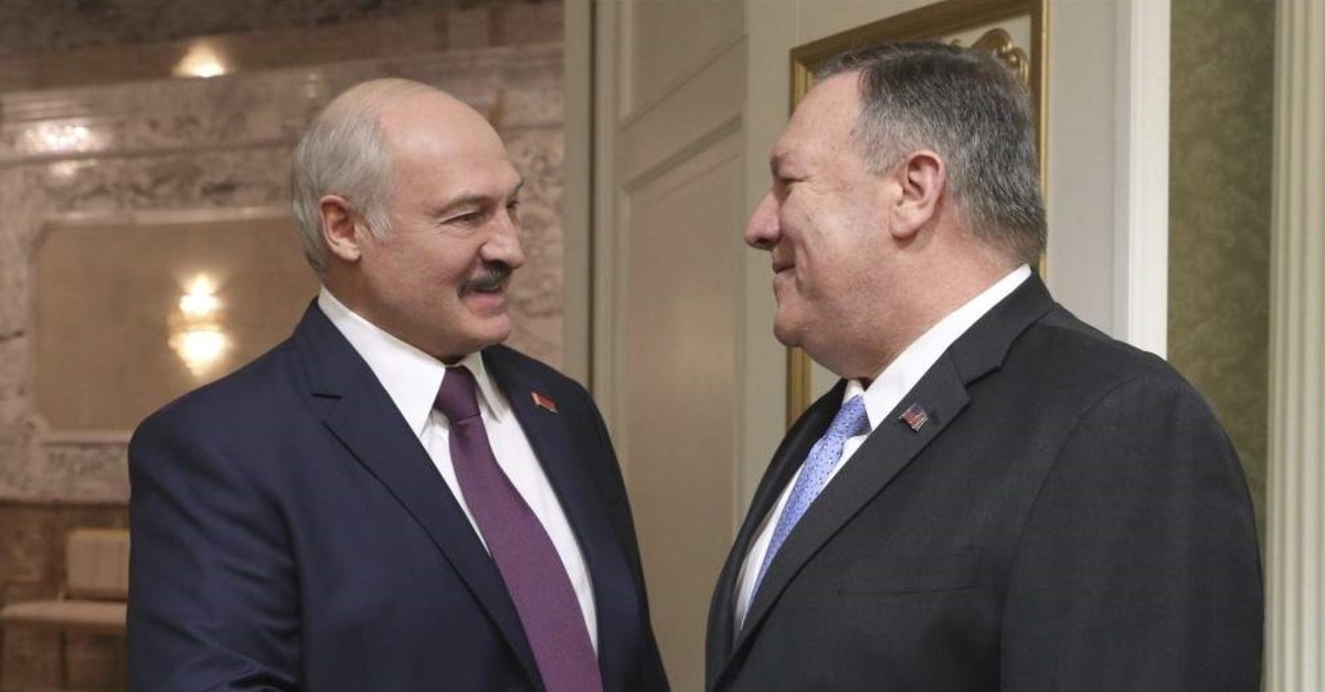 Belarusian President Alexander Lukashenko, left, greets U.S. Secretary of State Mike Pompeo during their meeting in Minsk, Belarus, Saturday, Feb. 1, 2020. (BelTA Pool Photo via AP)