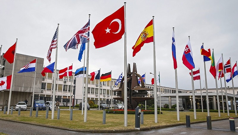 Flags of NATO member countries fly in front of the NATO headquarters in Brussels, Belgium, 28 July 2015. (EPA Photo)