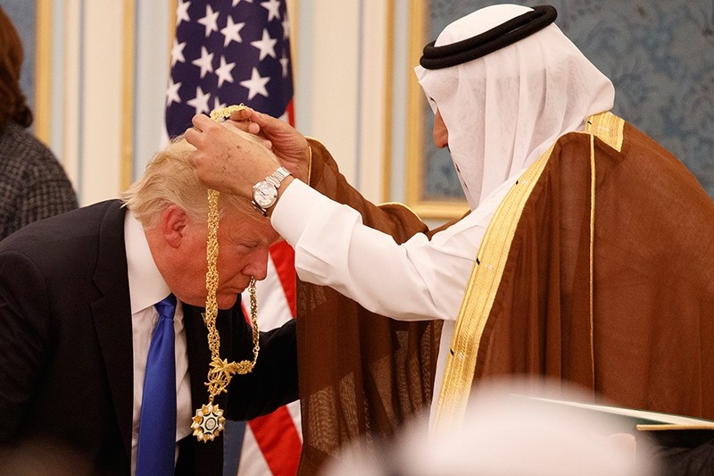 In this May 20, 2017 file photo, Saudi King Salman presents U.S. President Donald Trump with the highest civilian honor, the Collar of Abdulaziz Al Saud, at the Royal Court Palace, in Riyadh, Saudi Arabia. (AP Photo)