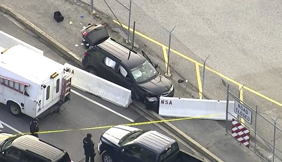 In this image made from video and provided by WUSA TV-9, authorities investigate the scene of a shooting at Fort Meade, Md. on Feb. 14, 2018. (AP Photo)