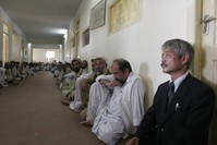 In this Aug. 28, 2008, file photo, Tetsu Nakamura, right, executive director of PMS Japan, participates in the memorial service for Japanese aid worker Kazuya Ito at the governor's house in Jalalabad, Nangarhar province, Afghanistan. (AP Photo)