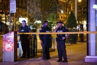 Toronto Police officers stand watch at Danforth St. at the scene of a shooting in Toronto, Ontario, Canada, July 23, 2018. (AFP Photo)