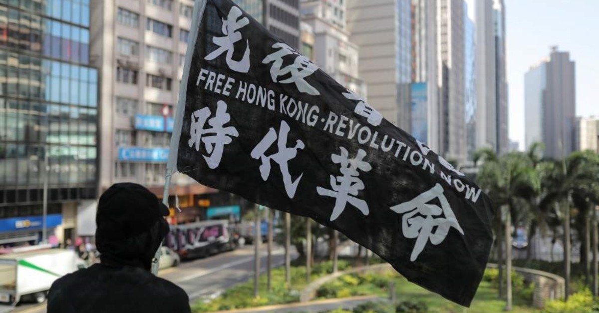 A man holds a flag during a lunchtime protest in Hong Kong, China, Nov. 28, 2019. (Reuters Photo)