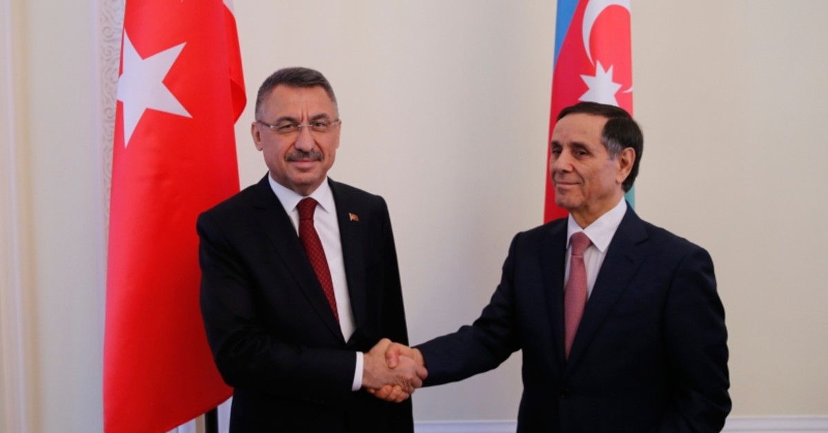 Turkish Vice President Fuat Oktay (L) and Azerbaijani Prime Minister Novruz Memmedovi shake hands at eighth meeting of the Turkey-Azerbaijan Joint Economic Commission (KEK) in Baku, Azerbaijan, on Sept. 16, 2019. (AA Photo)