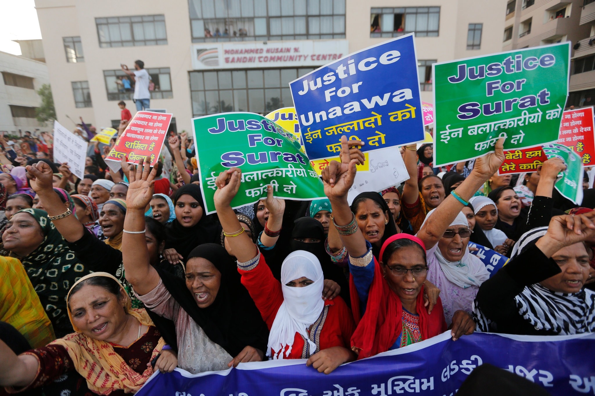 Indian women shout slogans as they participate in a rally to protest against recent incidents of rape, in Ahmadabad, India, Wednesday, April 18, 2018. (AP Photo)