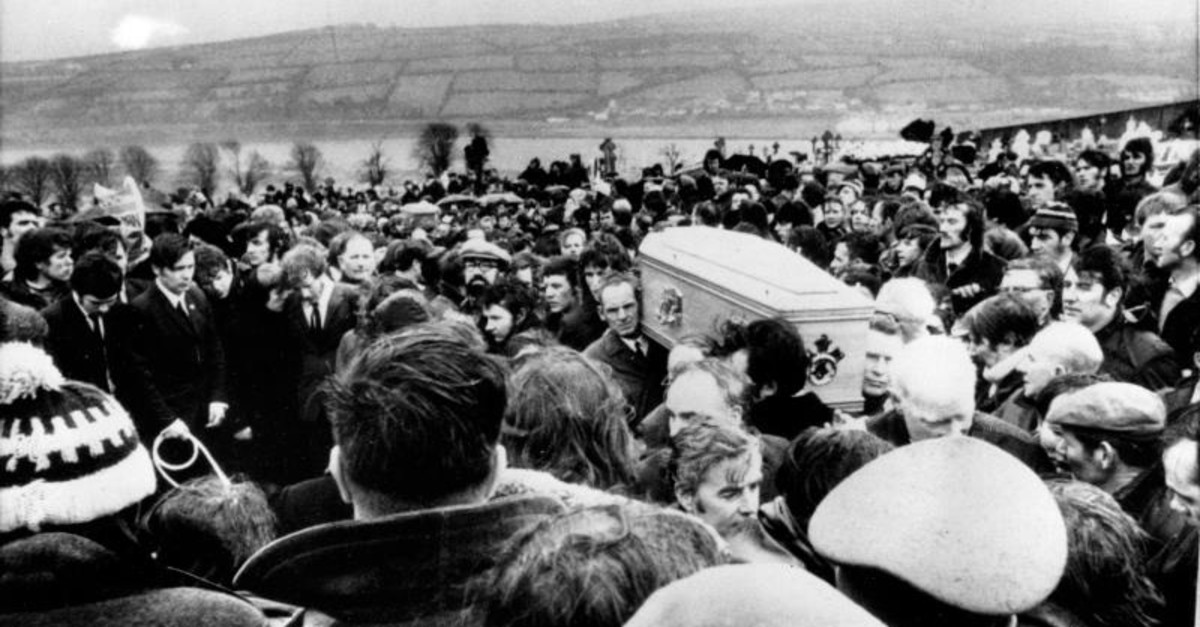 In this Feb. 2, 1972 file photo, pallbearers carry one of 13 coffins of Bloody Sunday victims to a graveside during a funeral in Londonderry, Northern Ireland. (AP Photo)
