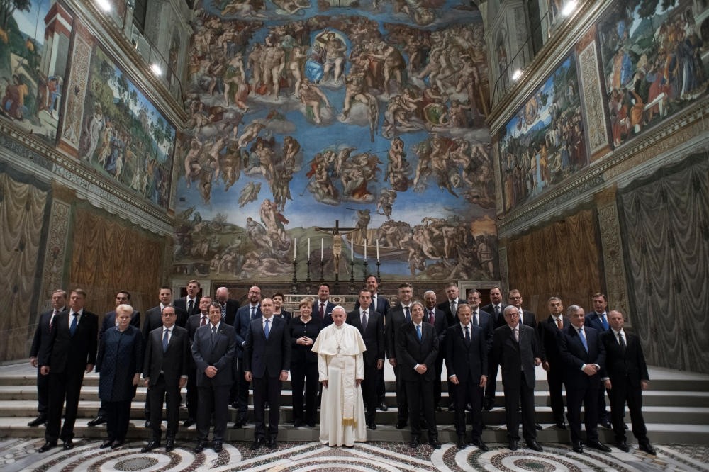 Pope Francis posing with the heads of state and EU institutions for a group photo in the Sistine Chapel at the end of a meeting at the Vatican, March 24, 2017. (AP Photo)