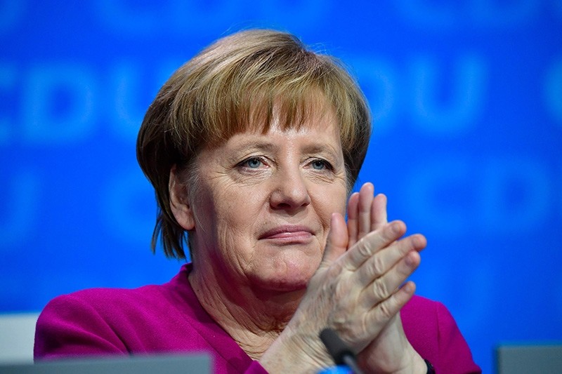 German Chancellor and leader of the Christian Democratic Union (CDU) Angela Merkel applaused during the party congress of the Christian Democratic Union (CDU) (AFP File Photo)