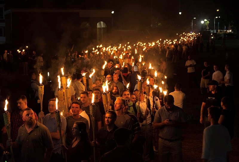 White nationalists carry torches on the grounds of the University of Virginia, on the eve of a planned Unite The Right rally in Charlottesville, Virginia, U.S. Aug. 11, 2017. (Reuters Photo)