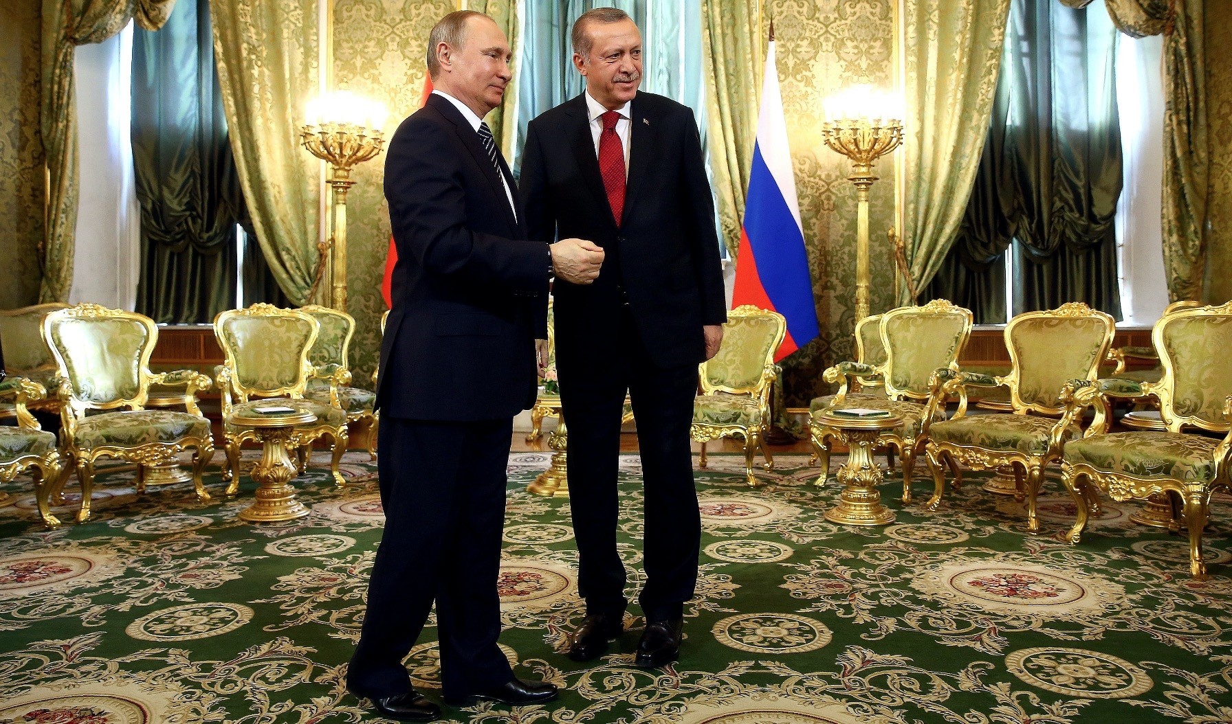 President Erdou011fan and Russian President Putin shake hands during a meeting in the Kremlin on bilateral relations and the Syrian crisis, March 10, 2018. 