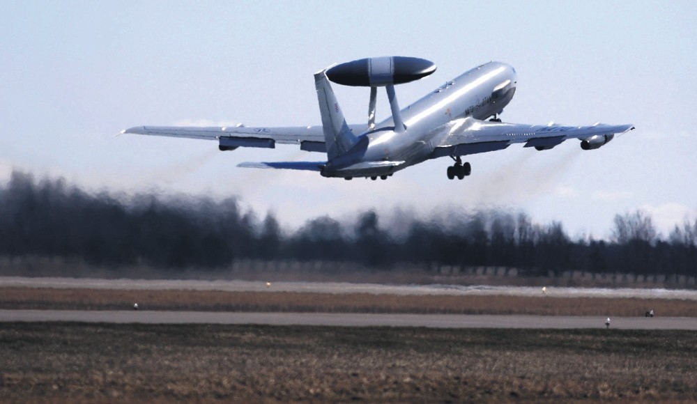 A NATO Airborne Warning and Control System (AWACS) aircraft take off during the Lithuanian - NATO air force exercise at the Siauliai Air Base some 230 kilometers east of the capital, Vilnius, Lithuania, April 1, 2014. 