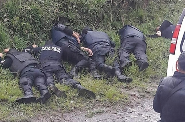 A handout photo made available by the news portal PueblaRoja shows the bodies of a group of police officers who were killed during a confrontation in the town of Chachapa, Amozoc municipality, Puebla, Mexico. (Via EPA)