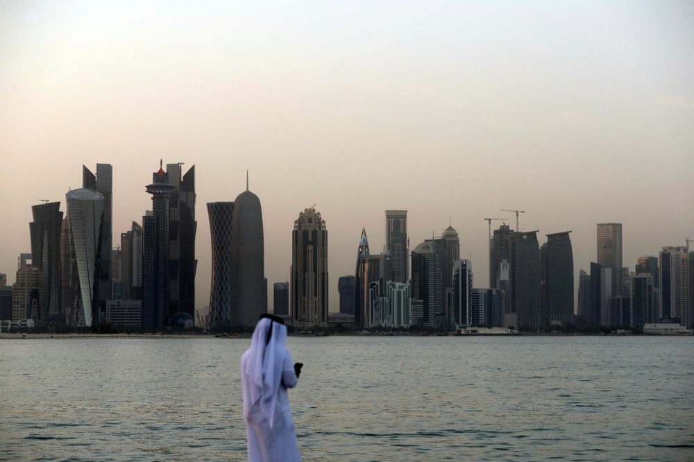 A man looks at his phone in the Qatari capital Doha, July 2. 