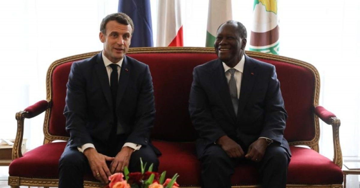 French President Emmanuel Macron meets with his Ivorian counterpart President Alassane Ouattara at the Presidential Palace in Abidjan on Dec. 21, 2019. (AFP)