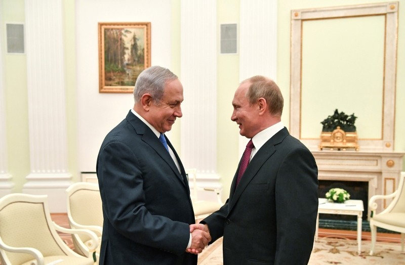 Russian President Vladimir Putin, right, shakes hands with Israeli Prime Minister Benjamin Netanyahu during their meeting at the Kremlin in Moscow, Wednesday, July 11, 2018. (AP Photo)