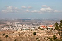A picture taken on Dec. 1, 2019, shows the Jewish settlement of Negohot (R), located near the Palestinian village of Beit Awwa (L) in the Israeli occupied West Bank. (AFP Photo)