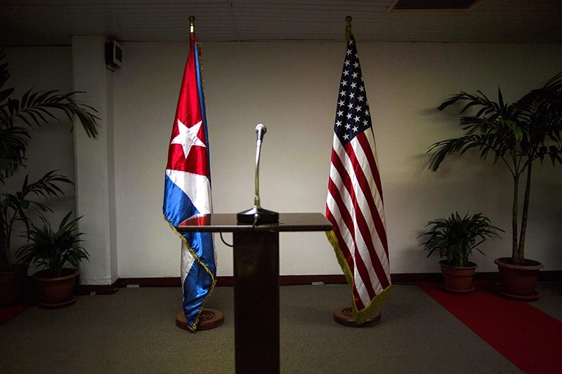  In this Jan. 22, 2015 file photo, a Cuban and U.S. flag stand before the start of a press conference on the sidelines of talks between the two nations in Havana, Cuba. (AP Photo)