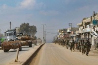 Turkish troops patrol on foot and in military vehicles in the town of Atareb in the western countryside of Syria's Aleppo province, Feb. 19, 2020. (AFP Photo)