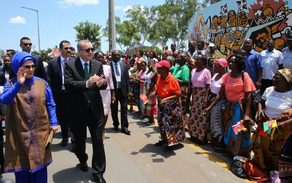 President Erdou011fan, accompanied by his wife First Lady Emine Erdou011fan, applauds the crowd during his visit to Mozambique to discuss on boosting the relations between Turkey and African countries, Jan. 24