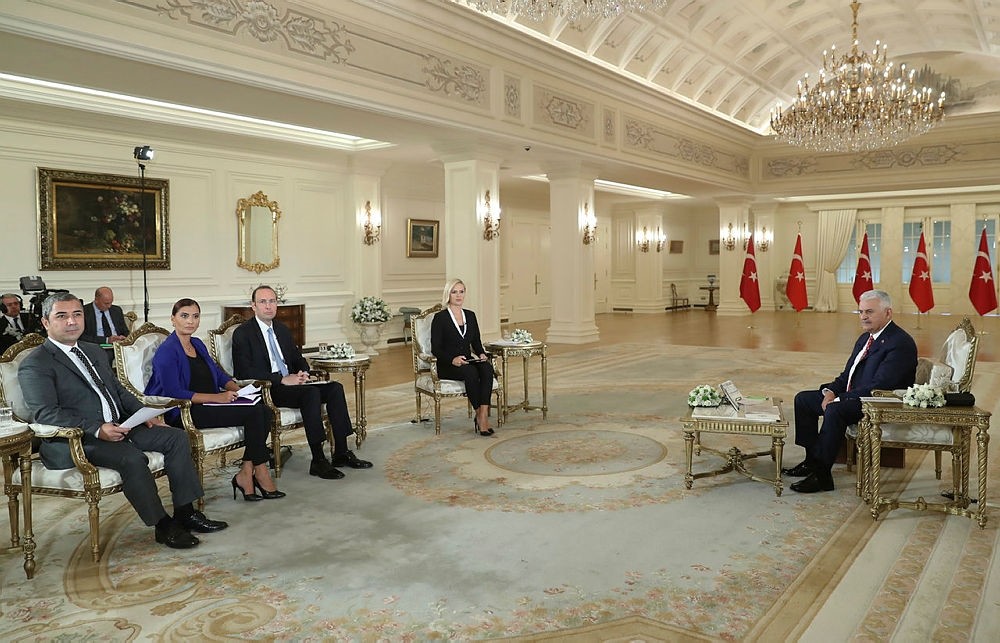 Prime Minister Binali Yu0131ldu0131ru0131m speaks at a televised interview in Ankara, Turkey, on Monday, September 25, 2017. (AA Photo) 