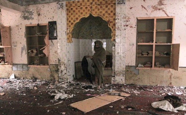 A Pakistani examines the site of Friday's bomb explosion inside a mosque in Quetta, Pakistan, Saturday, Jan. 11, 2020. (AP Photo)