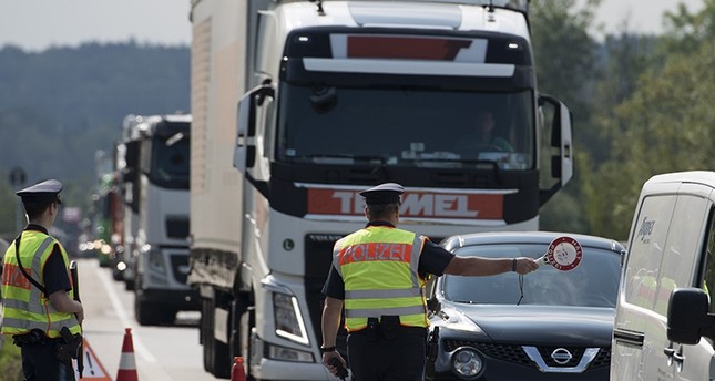Police officers check cars and trucks during a border inspection post at the German border to Austria in Kirchdorf am Inn, Bavaria, Germany, July 18, 2018. (EPA Photo)