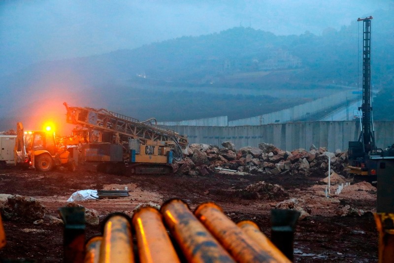 This file photo taken on Dec. 19, 2018 shows a view of Israeli excavation equipment at work near the concrete barrier along the border with Lebanon, near the northern Israeli town of Metula. (AFP Photo)