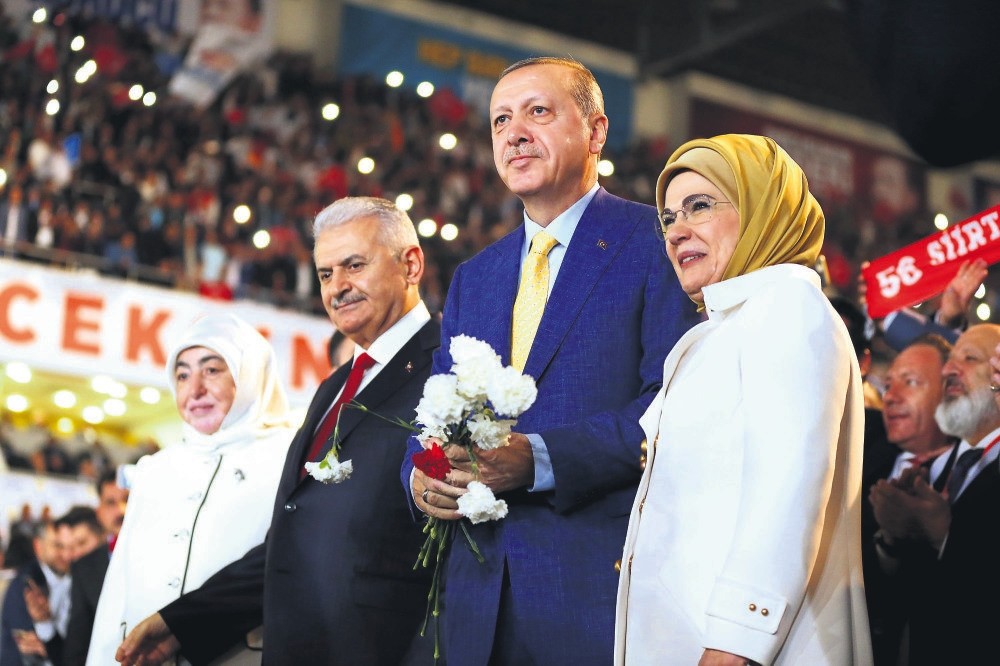 President Recep Tayyip Erdou011fan with his wife Emine Erdou011fan, right, and Prime Minister Binali Yu0131ldu0131ru0131m and his wife Semiha Yu0131ldu0131ru0131m, left, at a congress of the ruling AK Party in Ankara, May 21.
