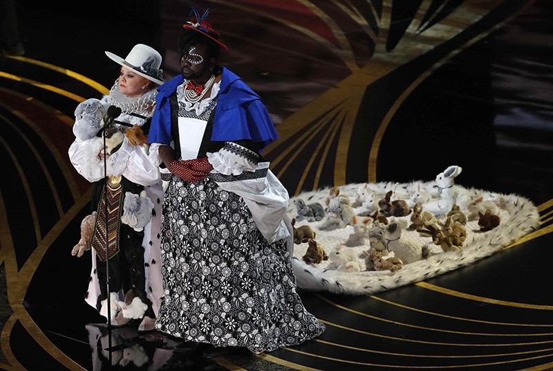 Melissa McCarthy and Brian Tyree Henry present the award for best costume design at the Oscars on Sunday, Feb. 24, 2019, at the Dolby Theatre in Los Angeles.