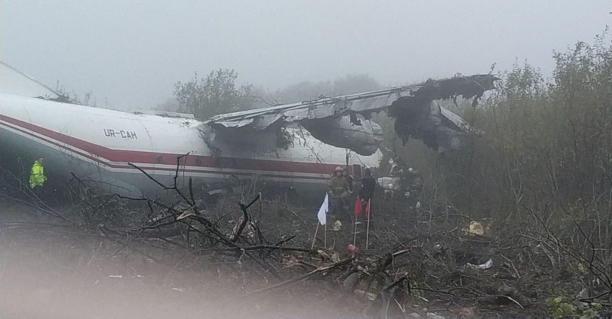 This handout photograph taken and released by The Ukrainian Emergency Ministry shows rescuers as they work at the plane crash site in a forest outside Lviv on October 4, 2019. (AFP Photo)