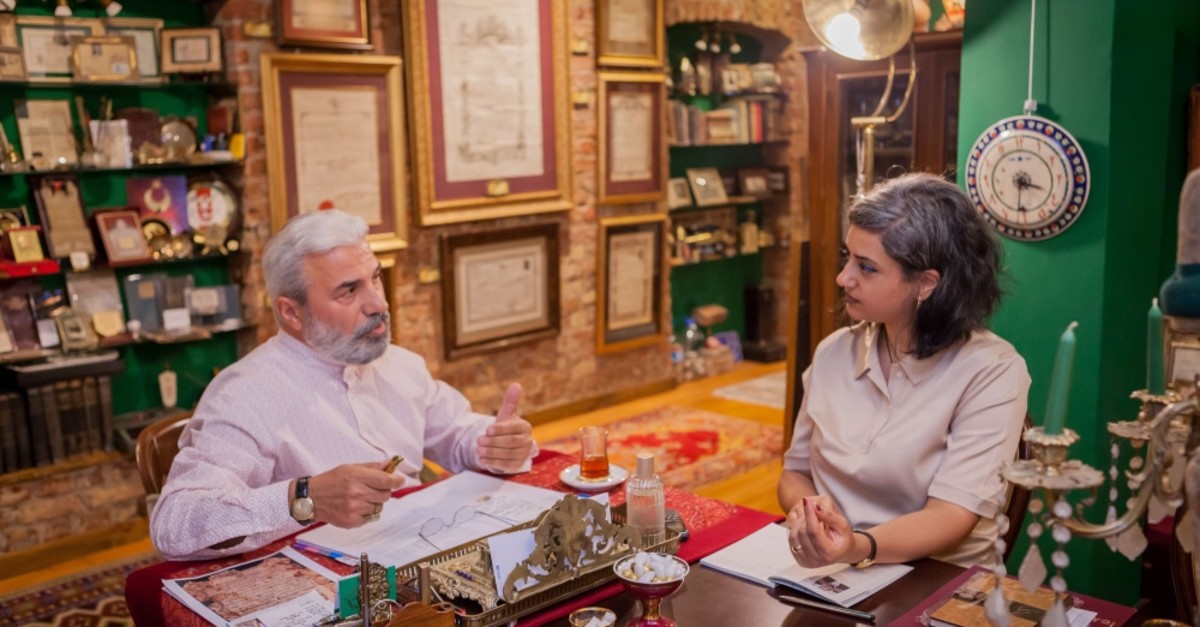 Daily Sabah Culture and Arts editor Zeynep Esra u0130stanbullu and collector Enver Beu015finci having a conversation on the history of ijazah licences.