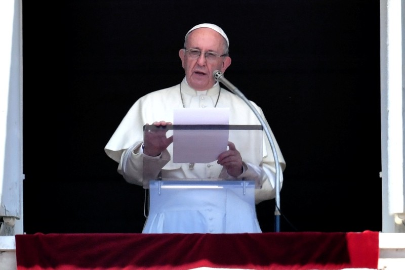 Pope Francis delivers his speech from the window of the Apostolic Palace overlooking St Peter's square during the Sunday Angelus prayer, on July 22, 2018 at the Vatican. (AFP Photo)