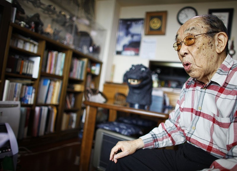 In this April 28, 2014 photo, original Godzilla suit actor Haruo Nakajima, who has played his role as the monster, speaks during an interview at his home in Sagamihara, near Tokyo. (AP Photo)