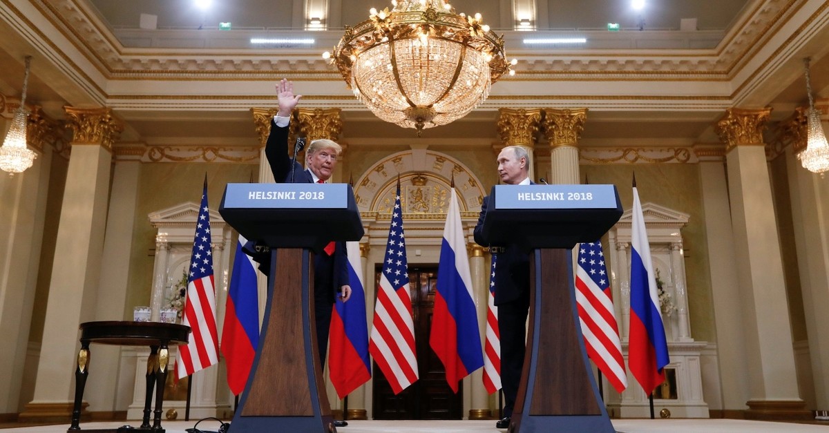 U.S. President Donald Trump waves after a joint news conference with Russian President Vladimir Putin (R), Helsinki, July 16, 2018. 