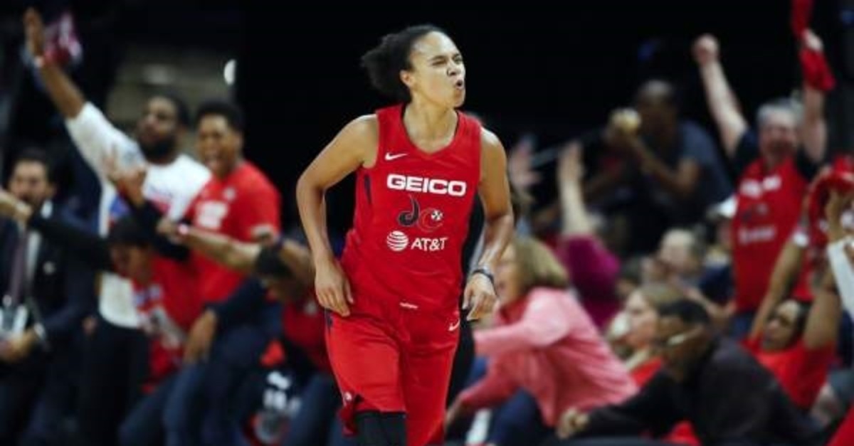 Washington Mystics guard Kristi Toliver celebrates after her 3-point basket during the first half of Game 5 of basketball's WNBA Finals against the Connecticut Sun in Washington, Oct. 10, 2019. Toliver is also an assistant coach with the Washington Wizards. (AP Photo)