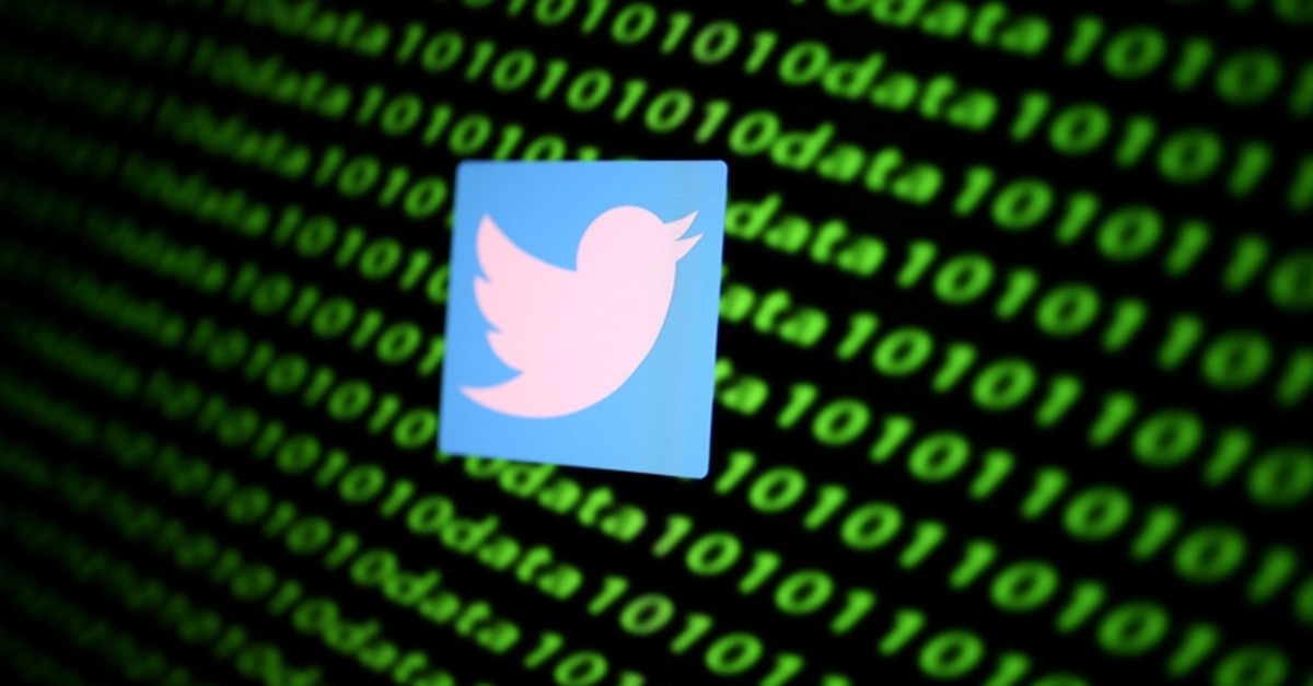 The Twitter logo and binary cyber codes are seen in this illustration taken November 26, 2019. (Reuters Photo)