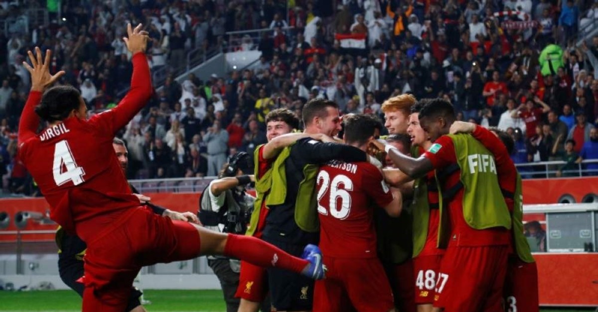 Liverpool's Roberto Firmino celebrates scoring the team's first goal with teammates. (Reuters Photo)