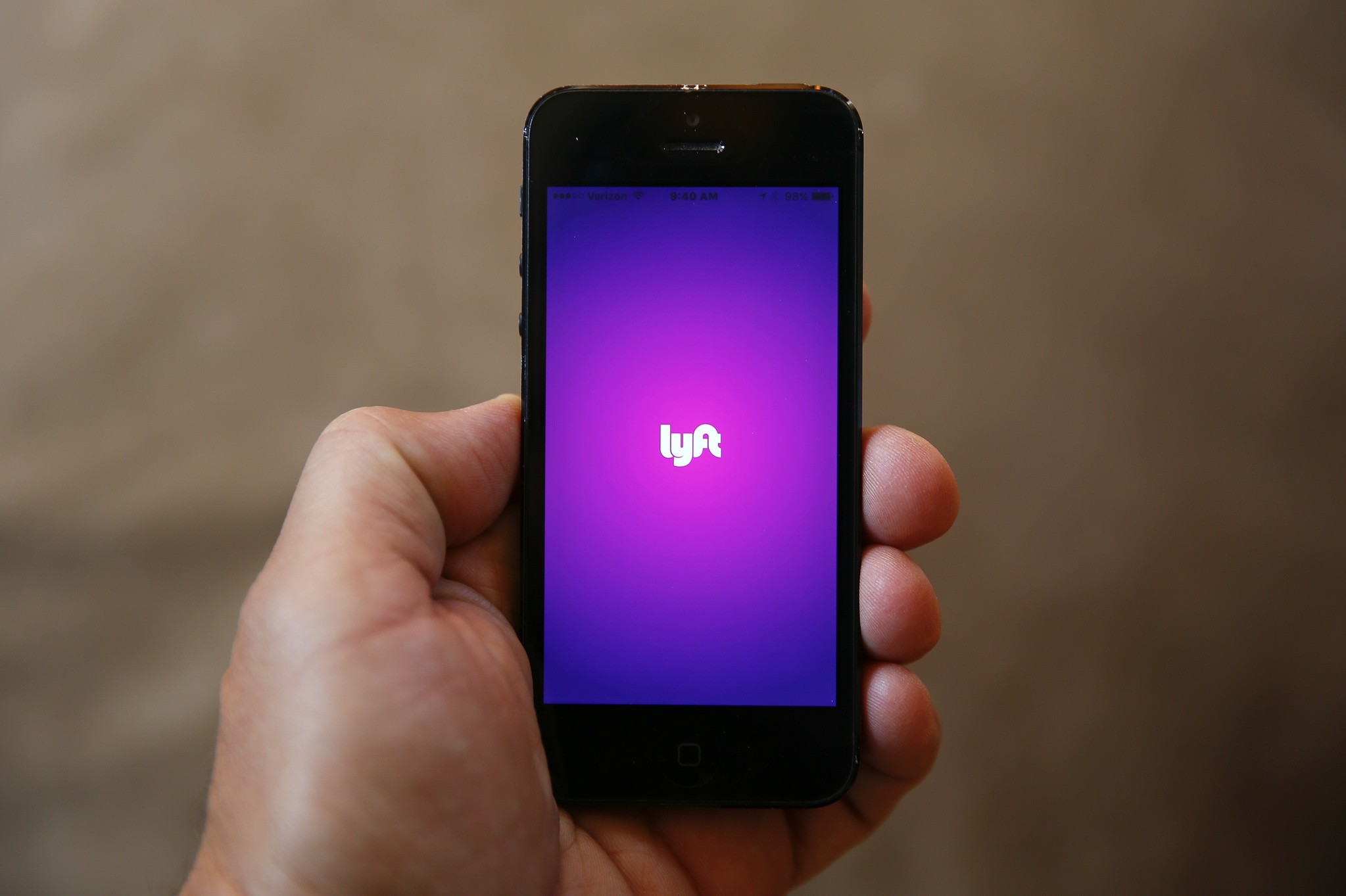 This Monday, May 16, 2016, file photo shows a smartphone displaying the Lyft app, in Detroit. (AP Photo)