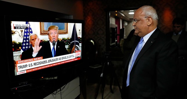 Chief Palestinian negotiator Saeb Erakat watches on U.S. President Donald Trump's speech during which Trump announced the recognition of Jerusalem as Israel's capital, Jericho, West Bank, Dec. 6, 2017. (AFP Photo)