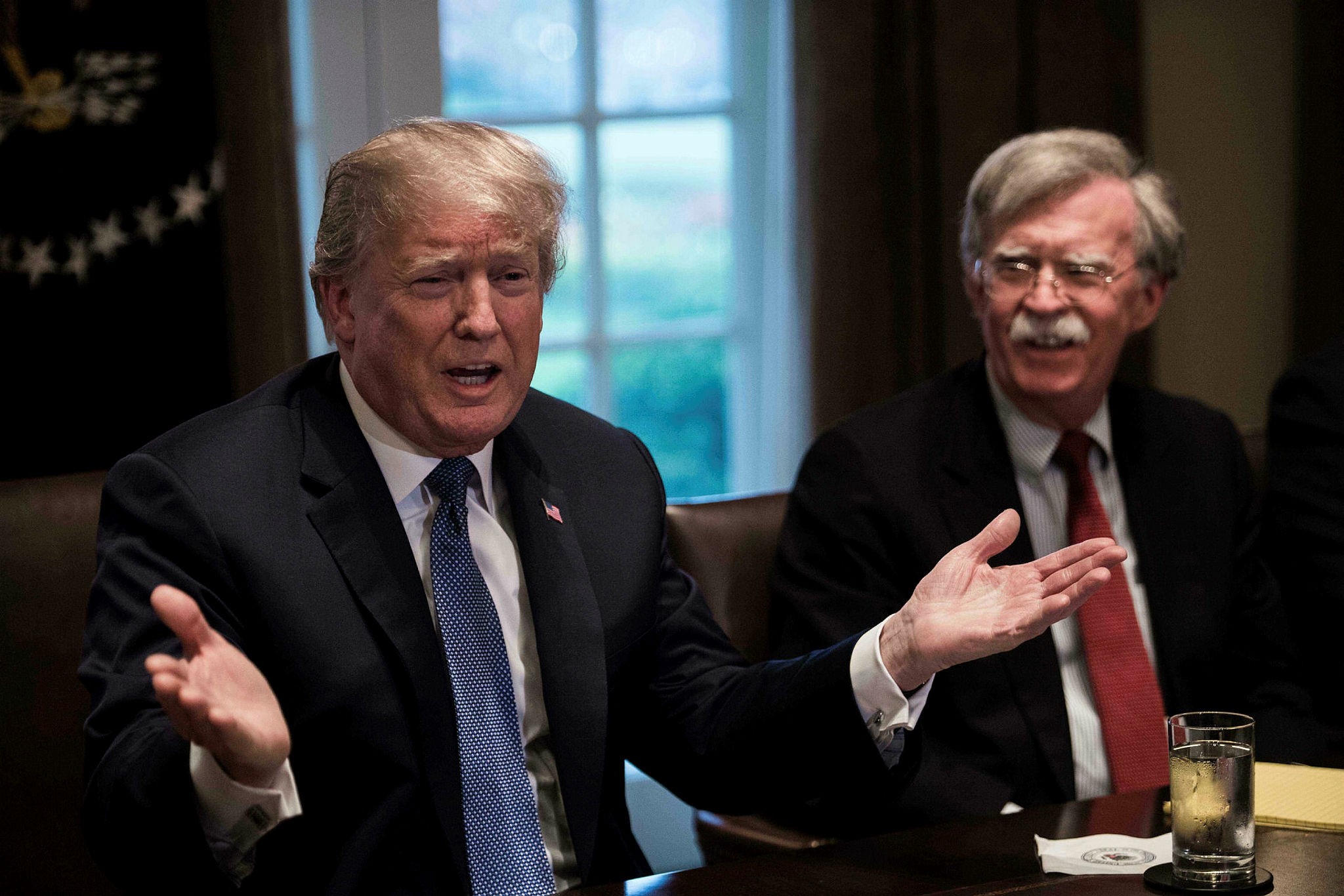 US President Donald Trump speaks during a meeting with senior military leaders at the White House in Washington, DC, on April 9, 2018. At right is new National Security Advisor John Bolton. (AFP Photo)