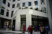 People look at luxury storefronts at the Manzana de Gomez Kempinski five-star hotel in Havana, Cuba.