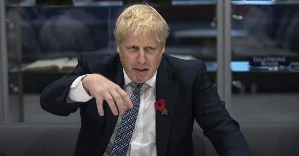 Britain's Prime Minister Boris Johnson during a visit to the Metropolitan Police training college in Hendon, north London, Thursday, Oct. 31, 2019. ( Aaron Chown / Pool Photo via AP)