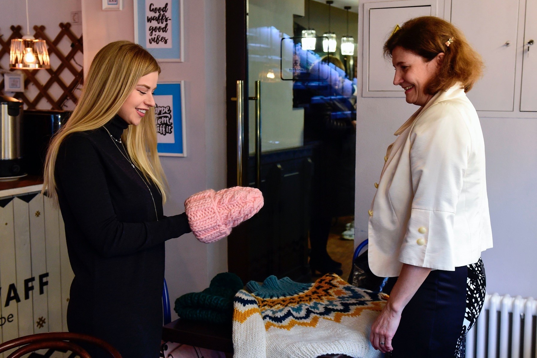 Yelena Tretyakova, 56, a participant of Grannyu2019s Instagram project, presents her knits to the founder of the project, Yulia Aliyeva, 27, in Saint Petersburg on Dec. 21, 2018.  