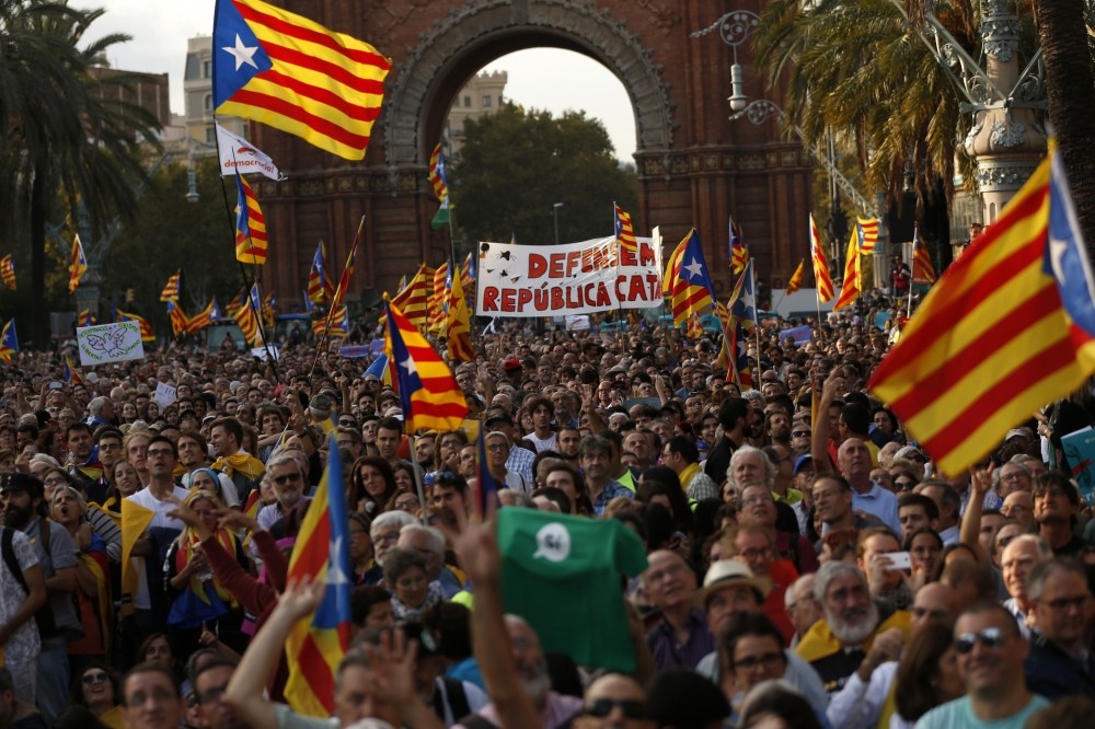 People with Catalan flags gather for a rally in Barcelona, Oct. 10. 