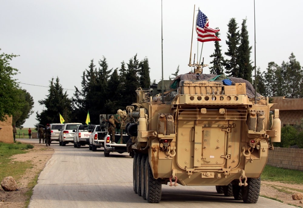 A U.S. tank follows a YPG terrorist convoy in Syria, Dec. 5, 2017.
